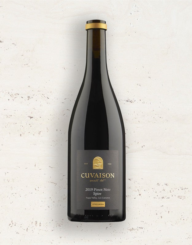 A bottle of 2021 Cuvaison Pinot Noir, Spire 1.5L with a dark label stands upright against a light, textured background.