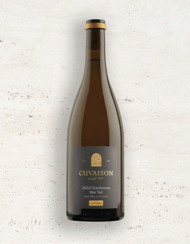 Wine bottle labeled '2022 Cuvaison Chardonnay, Kite Tail' on a textured white background