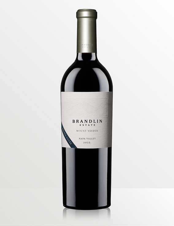 A dark glass bottle of Brandlin Estate Mount Veeder Napa Valley 2022 red wine stands upright on a light gray background. The bottle has a light-colored label and a metallic cap.