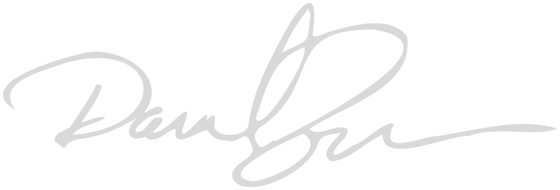A stylized, cursive signature written in light gray ink on a plain, light background. The signature consists of large loops and flowing lines.